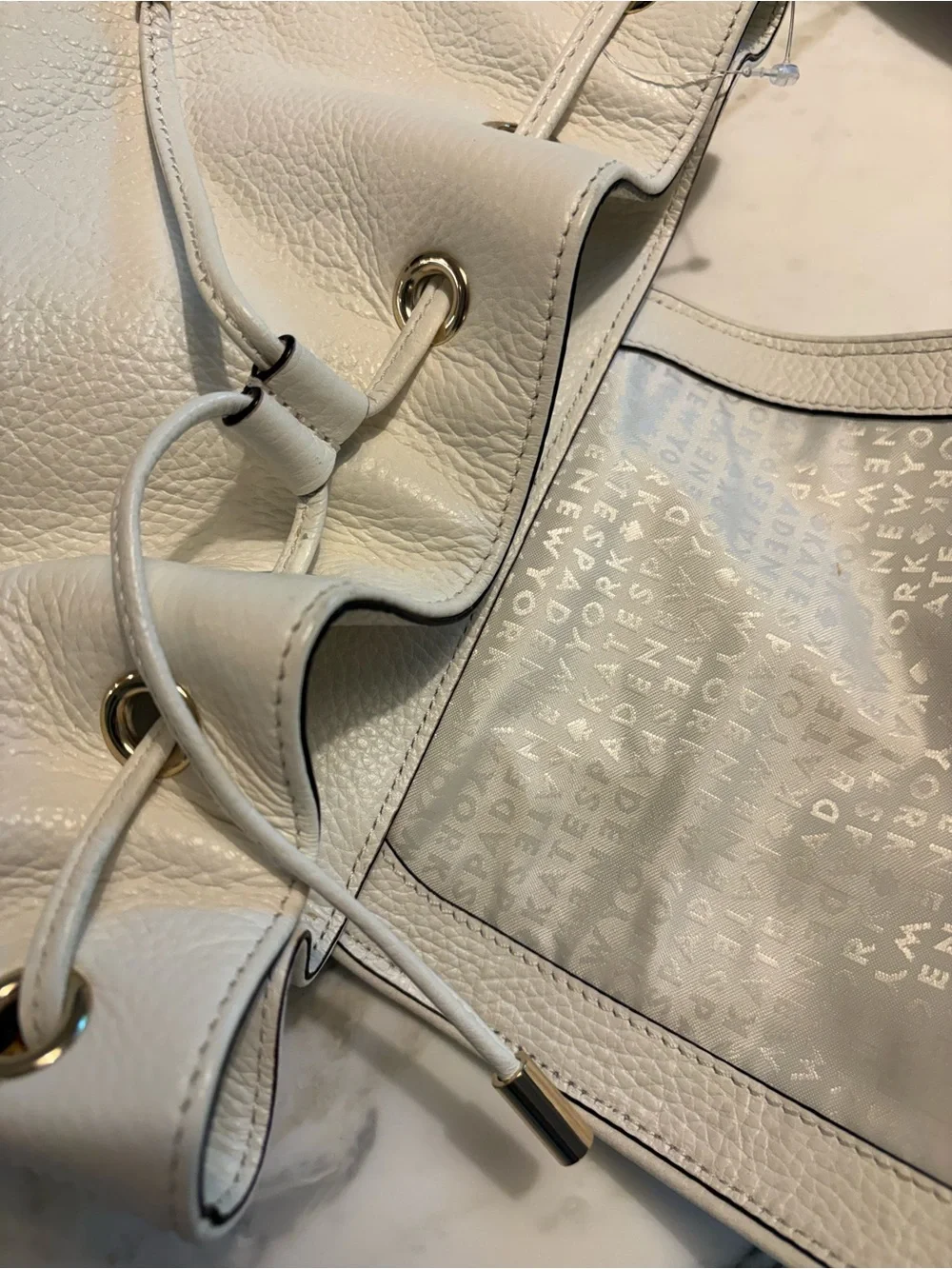 kate spade White Pebbled Leather Drawstring Backpack
